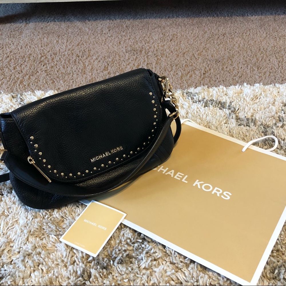 GORGEOUS Micheal Koran’s black studded bag.
